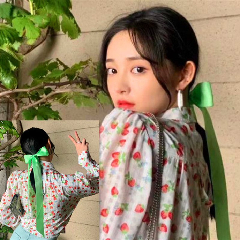 Green double-sided hairgrip with bow