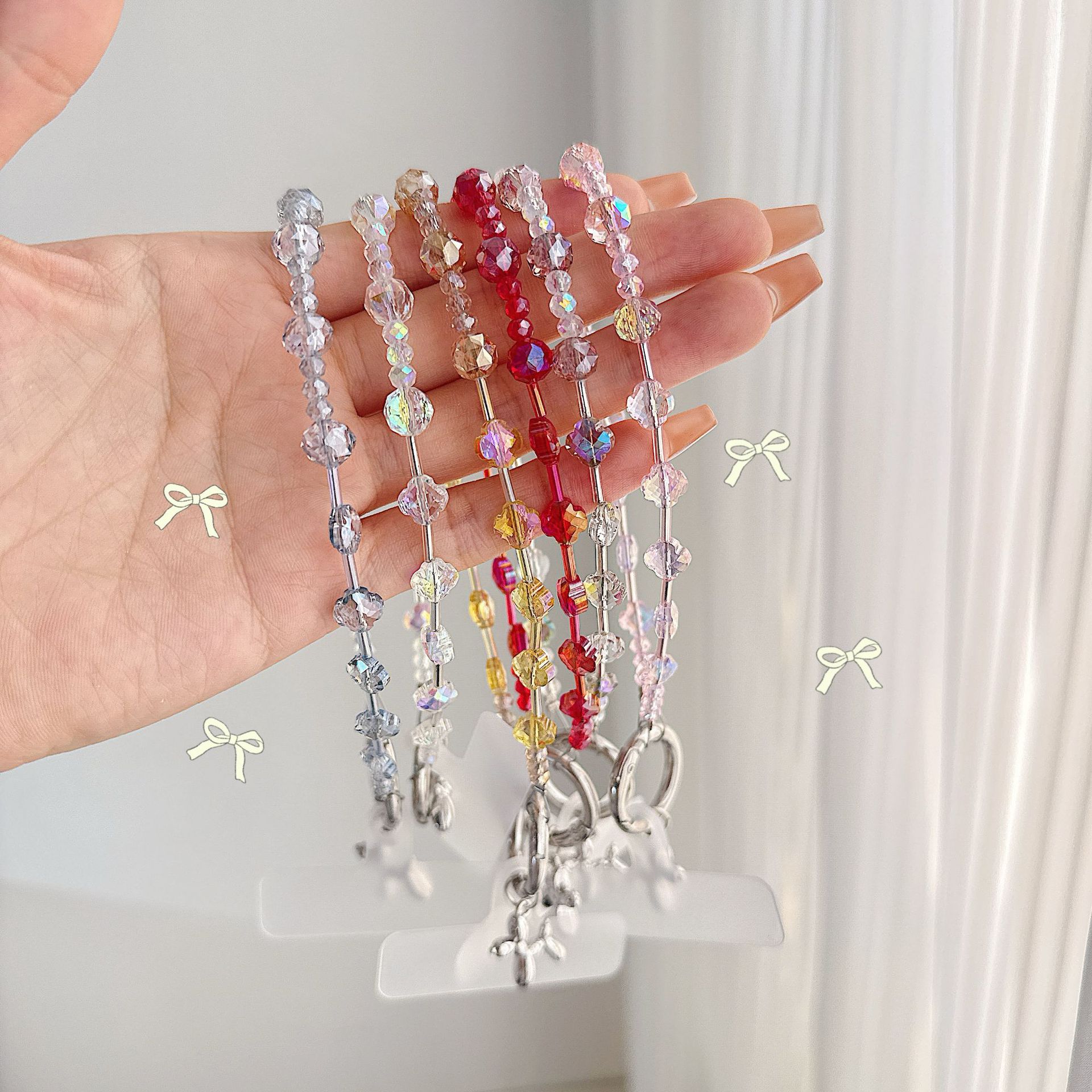 Boutique hecho a mano de alta gama para teléfono móvil cadena de muñeca de trébol de cuatro hojas de cristal original cadena de teléfono móvil de moda cuerda corta
