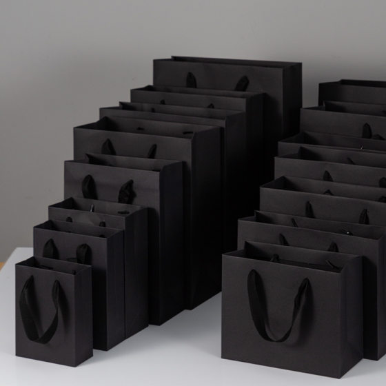 Hand vertical version bag retail black cardboard bag packaging bag food takeaway bag clothing shopping bag in stock Christmas