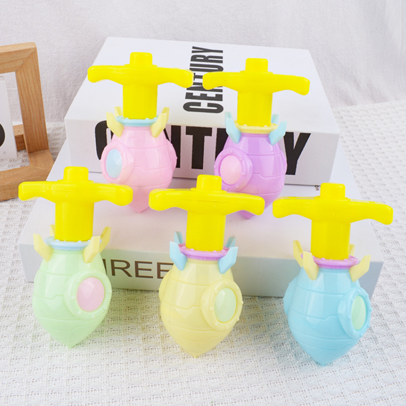 Cohetes creativos giroscópicos de luz jardín de infantes pequeños juguetes recompensas barracas de mercado nocturno juguetes luminosos bebés al por mayor