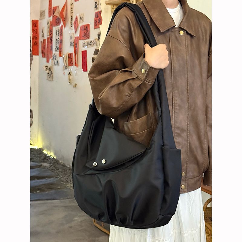 韩系复古通勤尼龙托特包女2025新款大容量流浪包男女通用邮差包