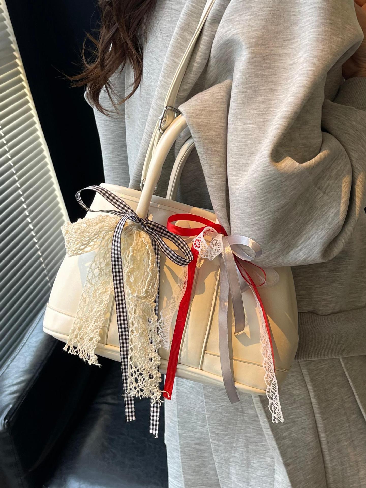 Bolsos de jardín portátiles populares de este año para mujer 2025 nuevos productos bolsos de hombro coreanos de nicho bolsos de cubo de todo fósforo de alta gama