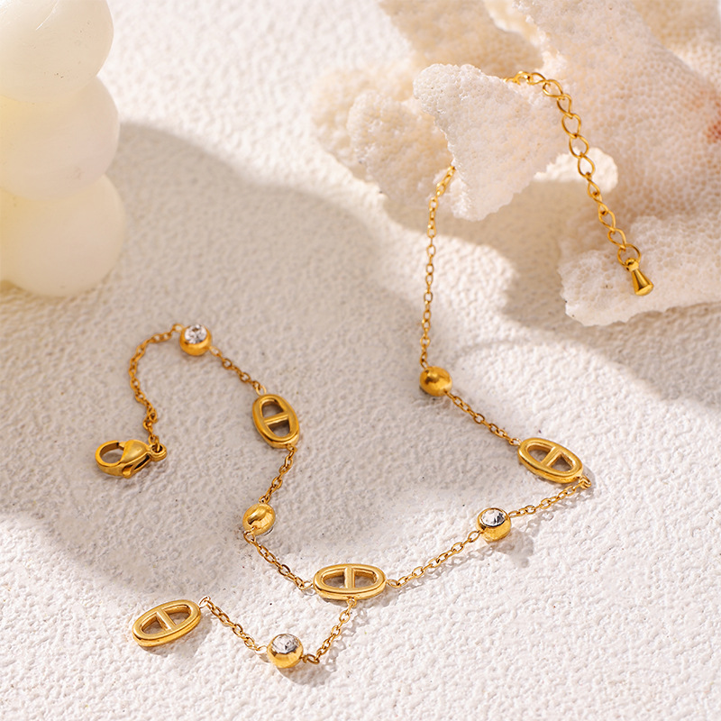 Tina Europa y los Estados Unidos acero inoxidable transfronterizo chapado en oro 18K nariz de cerdo zircon blanco conchas dobles tobillas joyerías no desvanecidas
