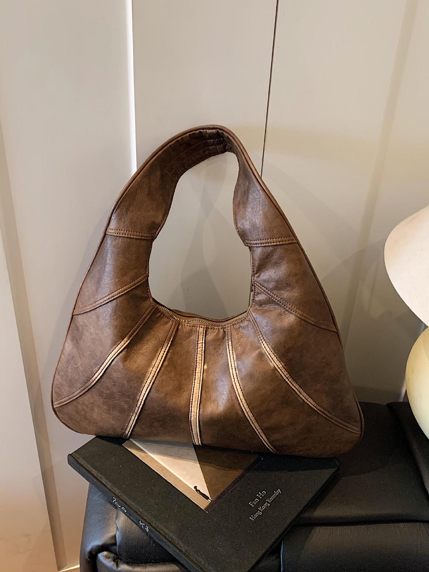 Bolsos retro para axilas para mujer 2025 nuevo bolso de hombro de nicho casual de todo fósforo bolso de viaje portátil de alta gama de moda