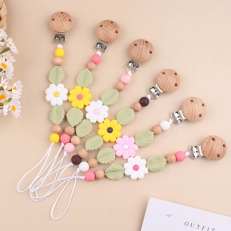 Nuevos productos para bebés Clip de chupete de haya Creativo bebé Silicona margarita mordida molar cadena de chupete anti-caída