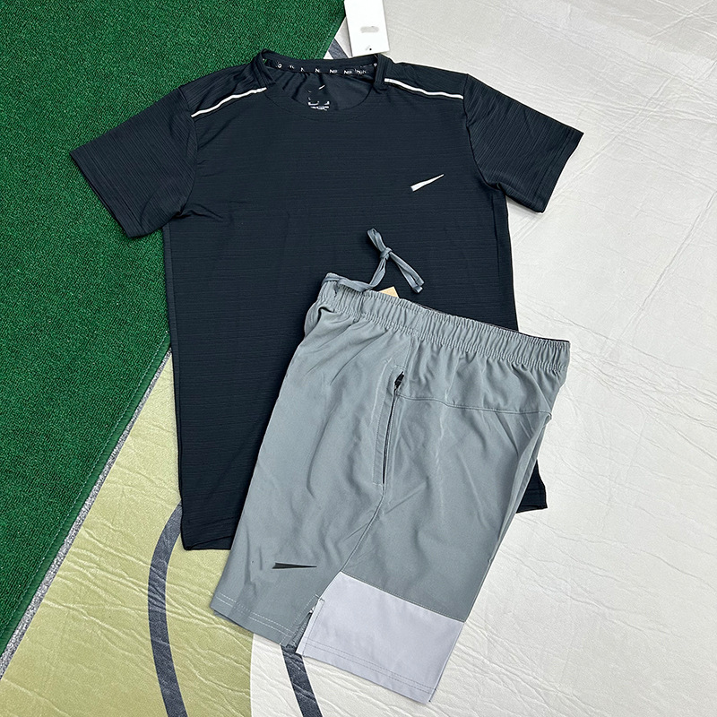 Mayorista nuevo juego de comercio exterior deportivo fitness juego de carrera rápida secado transpirable suelto ocio pantalones cortos de manga corta ropa de hombre