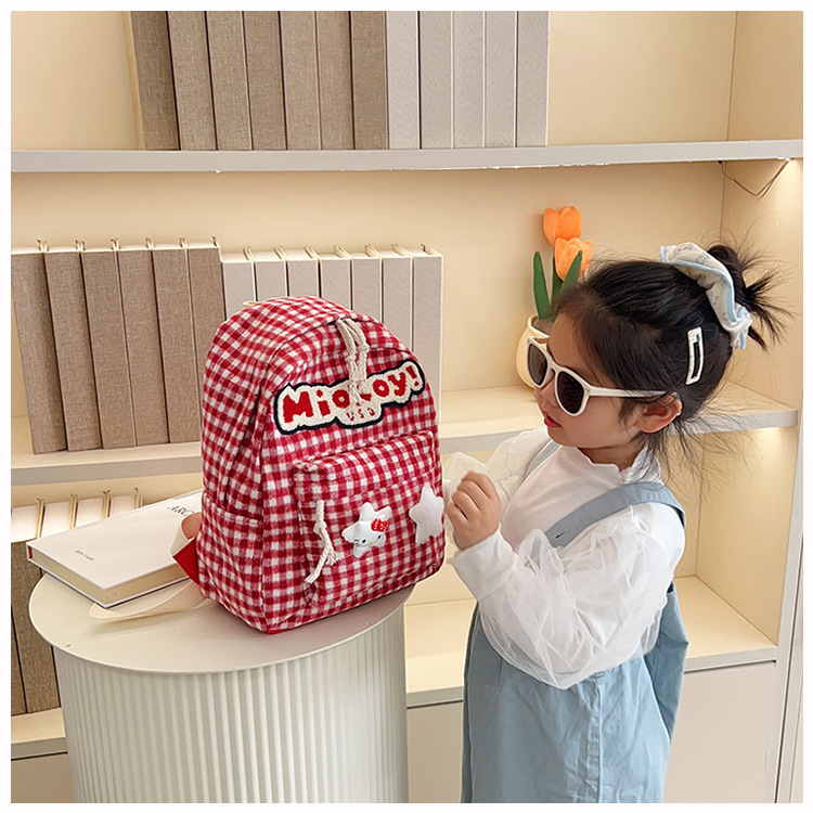 The large-capacity red woolen checkered backpack for primary and secondary school students is a unique and versatile choice. It's a trend for girls to carry backpacks during their leisure trips undefined