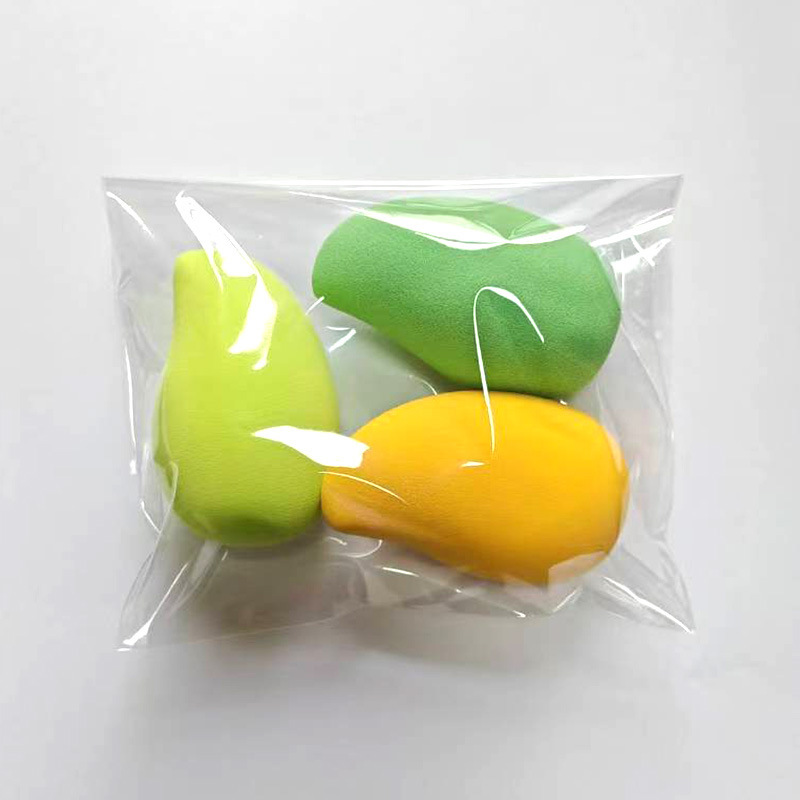 Red de alta calidad, el mismo estilo de huevo de belleza de mango, agua sin látex, gran maquillaje seco y húmedo, hojaldre, mar de frutas