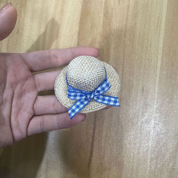 small woven plush toy with bow