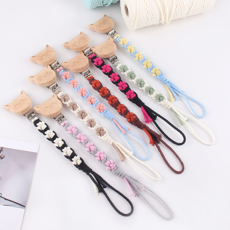 Nuevo clip de chupete de madera de haya de animal de dibujos animados creativo tejido a mano pata de perro textura chupete de algodón cadena anti-caída