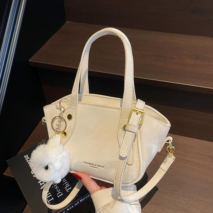 Nicho de diseño de tendencia bolso de cubo de mano mujer 2025 nueva moda bolso de hombro de estilo extranjero para trabajar bolso de transporte