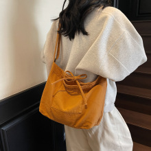 休闲百搭斜挎包包女简约大容量帆布包蝴蝶结女大学生上课单肩包