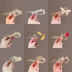 レトロ真珠花ツイストクリップ高級感金属蝶ネット赤ヘアクリップ古風盤頭優雅ヘアピン卸売り