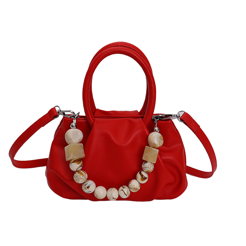 Alta sensación de mano pliegueada nube bolso de cubo para mujeres 2026 nuevo nicho de lujo ligero de moda perla bolsa de mochila