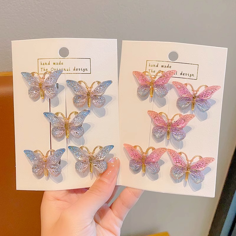 Estilo explosivo Super Fairy Symphony Horquilla de mariposa tridimensional Clip de pelo roto femenino Tocado Clip de pico de pato Horquilla para niños con sentido avanzado