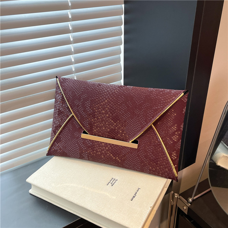 Nicho de estilo extranjero personalidad bolsa de cena casual para mujeres de verano nueva moda color sólido retro versátil bolso de mano de alta calidad