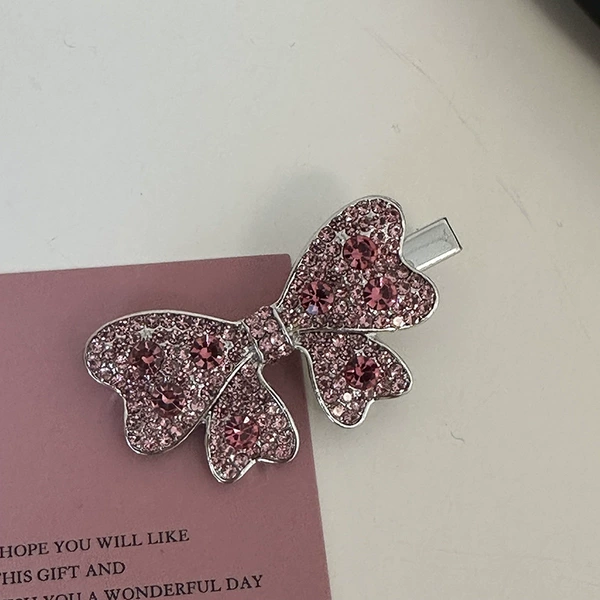 With bow, diamond encrusted
