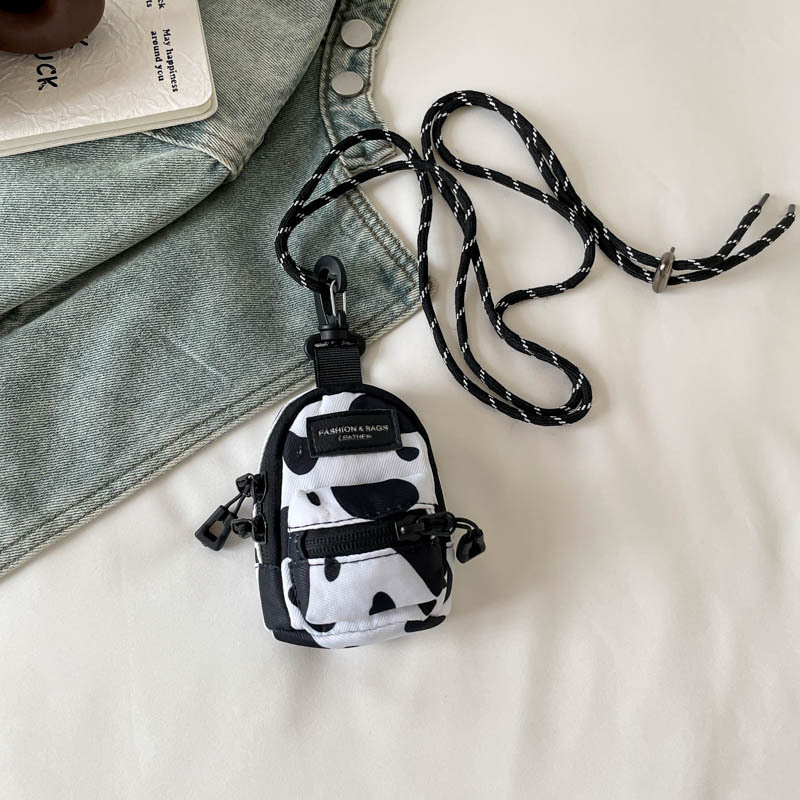 Mini lápiz labial auricular bolsa pequeña 2024 nueva tendencia moda colgante bolso de tela de diseño de nicho bolso de mensajero de un solo hombro