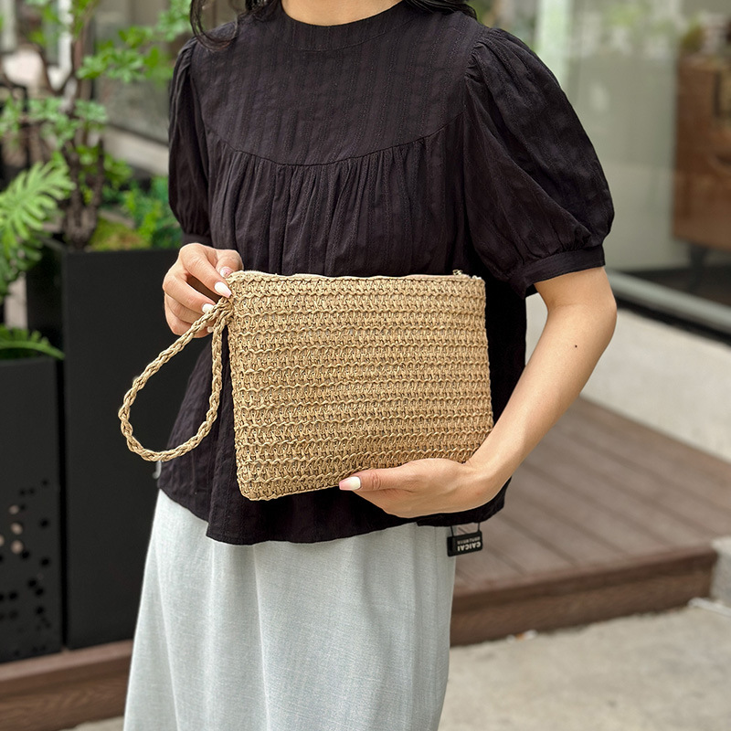 Bolsa de moda de playa de trenzado retro para mujeres 2026 primavera nueva moda simple estilo