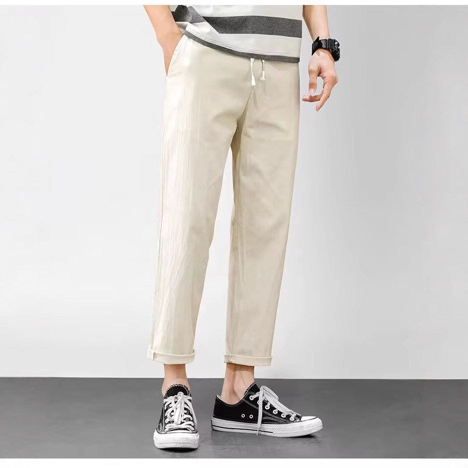 Pantalones casuales para niños otoño nueva marca de moda ropa de trabajo recta suelta nueve puntos pantalones largos deportivos 2025 primavera y otoño ropa de hombre