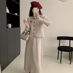 韓国系減齢ファッションスーツ女性春秋2025新型子犬刺繍ニットカーディガン痩せロングスカート2点セット