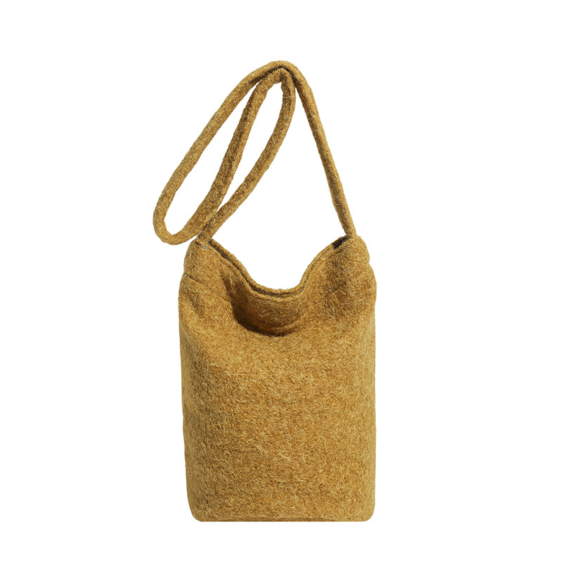 Bolsa de moda coreana de lana 2025 nuevo bolso de cubo de peluche suave glutinoso estilo extranjero de moda bolso de hombro de una sola mujer