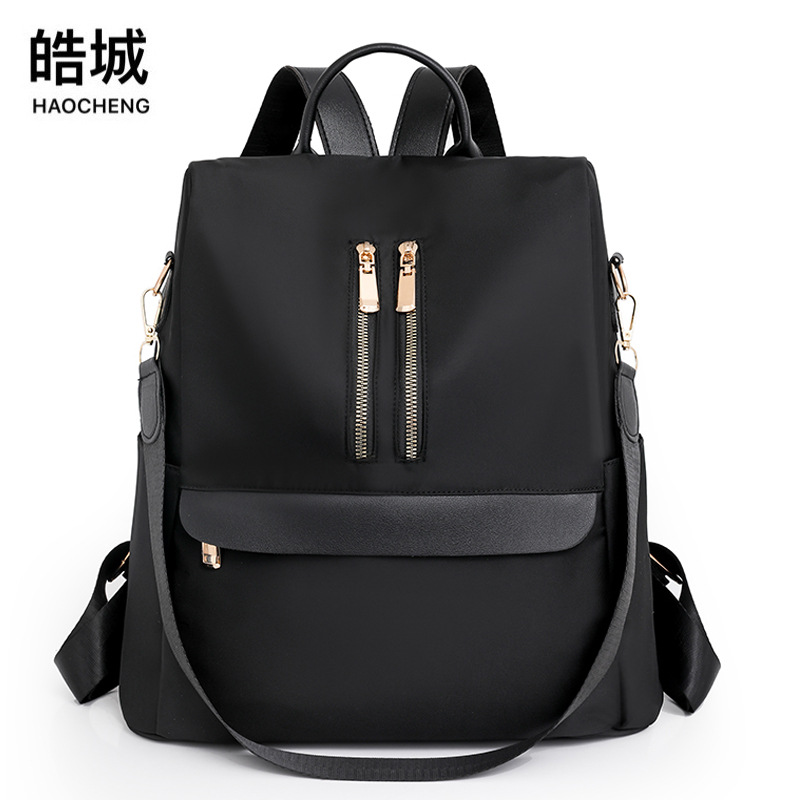 Comercio exterior al por mayor 2023 nueva mochila antirrobo de nailon para mujer casual tendencia de moda mochila de doble uso de gran capacidad