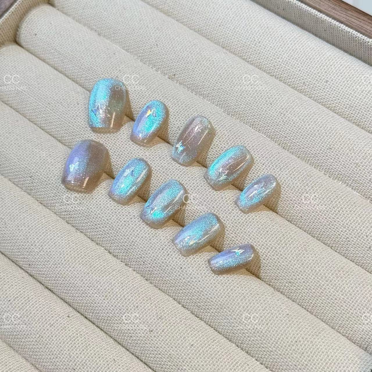 [Perlas] El ojo de gato está hecho a mano, el temperamento de la uña es suave y blanco, y el parche de manicura de fototerapia con diamantes está terminado.