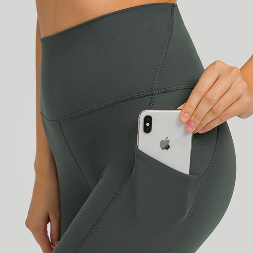 One piece drop shipping new upgraded nude yoga pants high waist abdominal side pocket sports running fitness nine-point pants