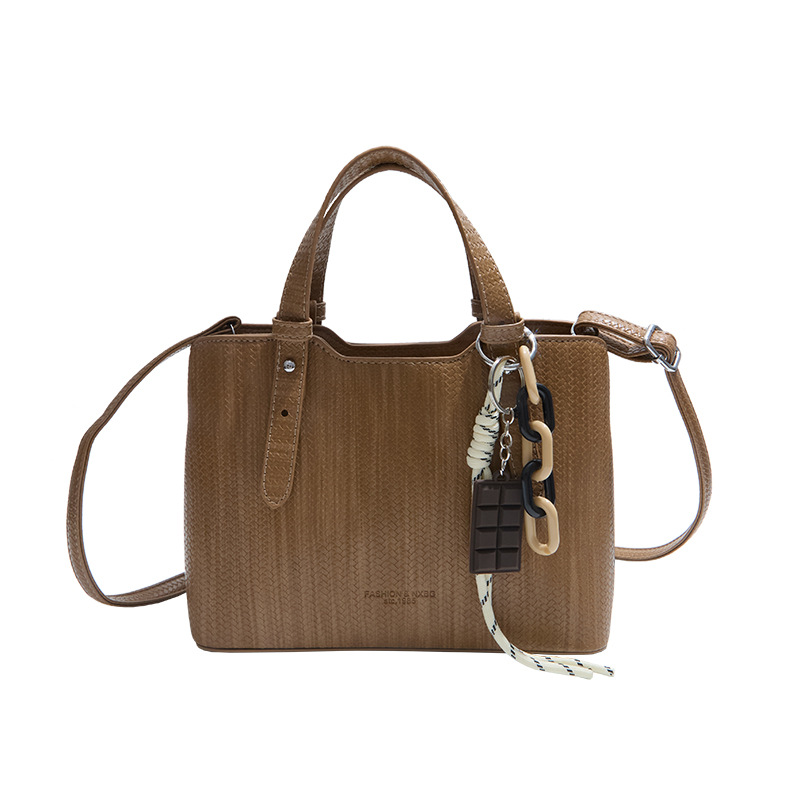 Texturas casuales bolsas de mano para mujeres otoño y invierno 2025 nueva moda simple bolsas de hombro versátiles retro mochila