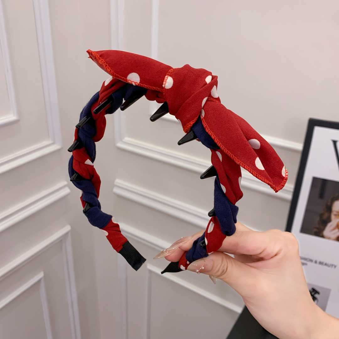 A red polka dot contrasting color bunny ear comb headband
