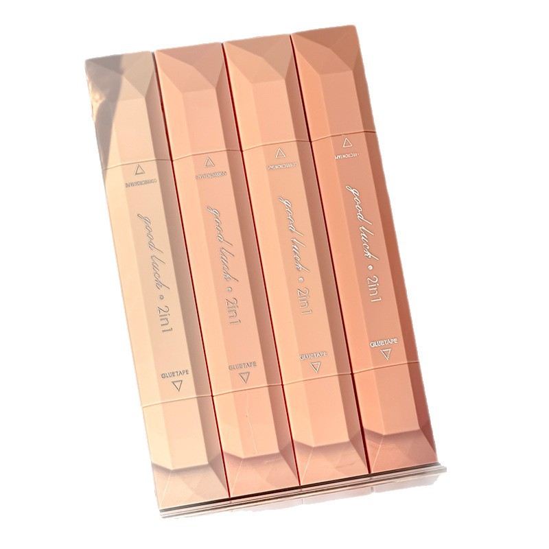 La nueva cinta correctora dos en uno, un poco de pegamento, pequeño libro rojo, el mismo párrafo, cinta correctora de doble cabezal y doble propósito, papelería para estudiantes