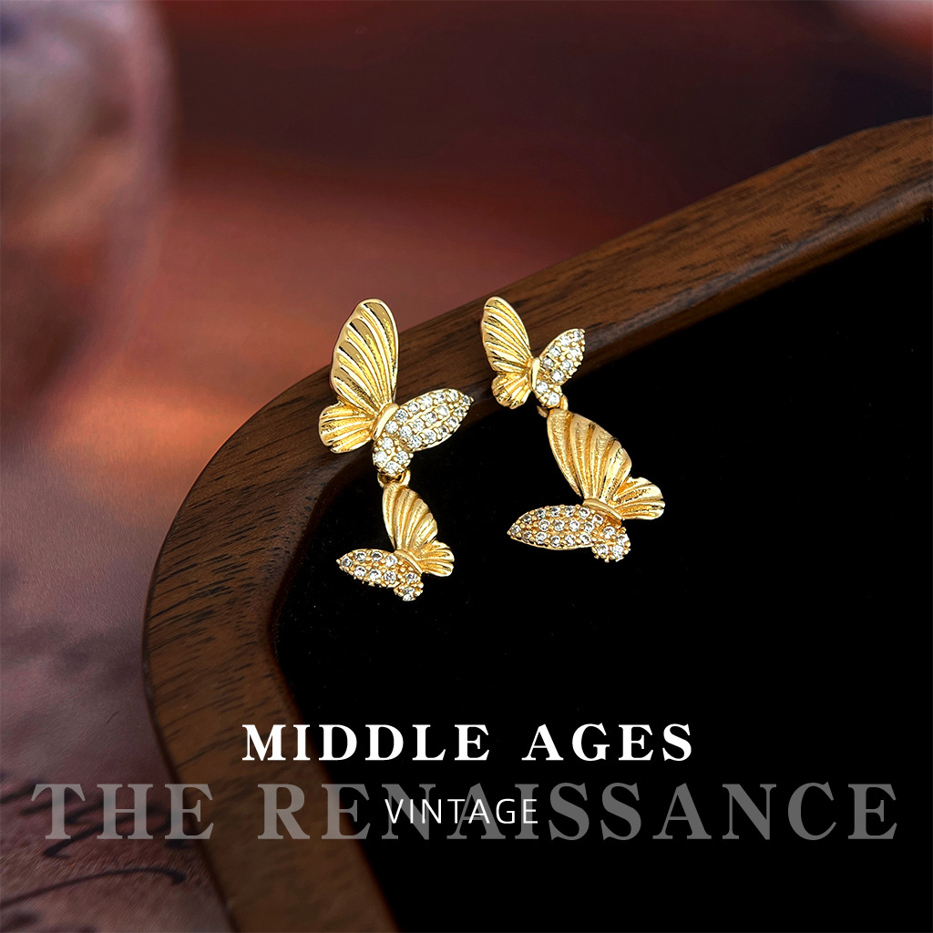 Vintage ligero estilo medio antiguo ligero circonio de lujo ligero aretes de mariposa doble estilo artístico francés retro aretes de alta gama mujeres