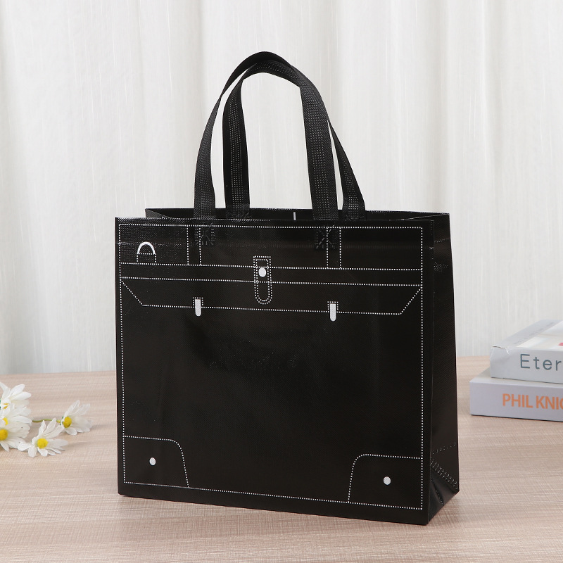 Bolsa de tela no tejida portátil gruesa bolsa de embalaje tridimensional resistente al desgaste de gran capacidad de equipaje de dormitorio de estudiantes bolsa de mano