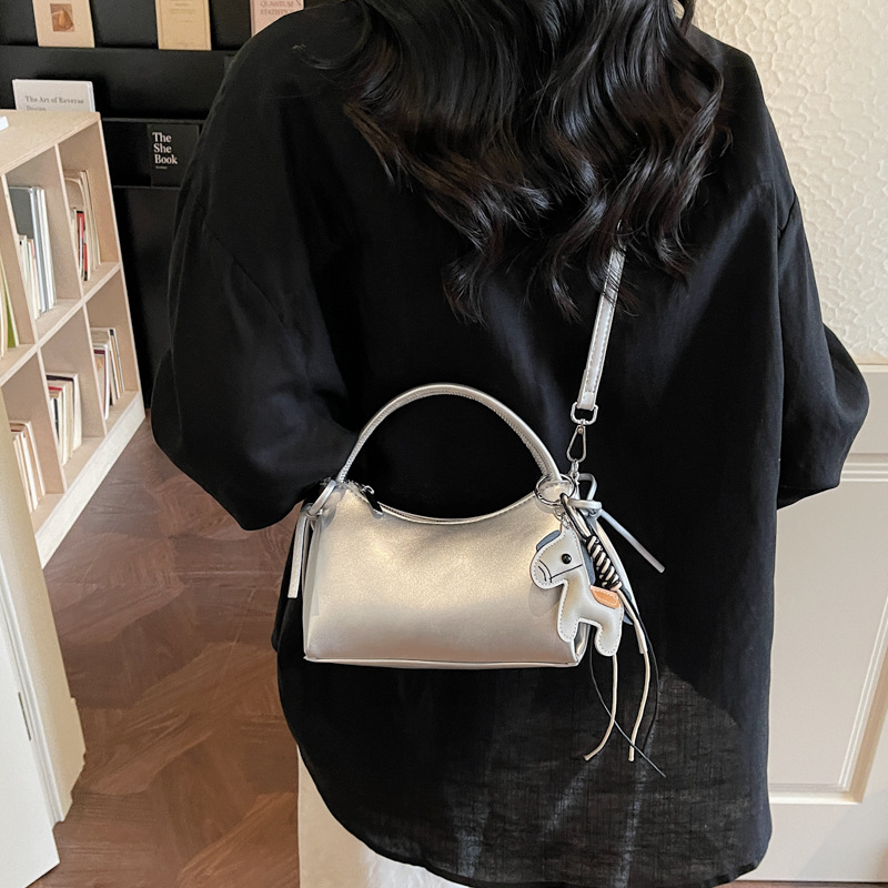 Meilade viento suave cuero brazo bolso para mujeres 2026 nuevo estilo de moda de viaje bolso de hombro sensación diaria simple mochila