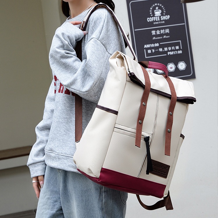 Water repellent capacious travel bag