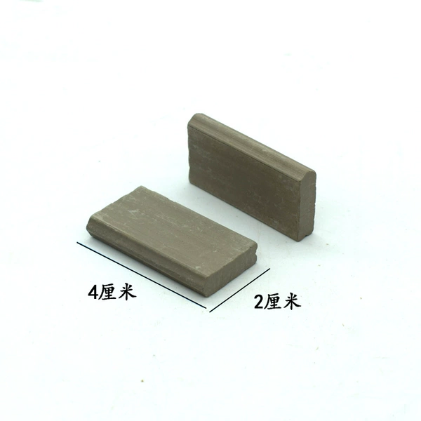 1 pellet of green short square tiles