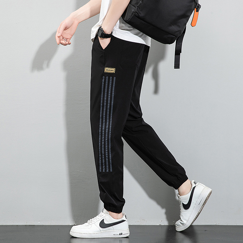 Pantalones de seda de hielo, pantalones deportivos de secado rápido de verano para hombres, pantalones casuales de nueve puntos sueltos y delgados de la marca de moda, pantalones casuales de nueve puntos al por mayor