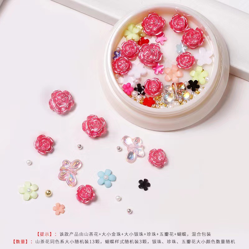 Nueva celebridad en línea suministros de uñas 3D multicolor de alto grado Camelia mariposa cinco pétalos flor bola de acero joyería de uñas diamante