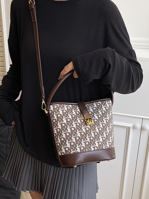 Bolso de mano exquisito de alta gama para mujer 2025 nuevo bolso de cubo retro con estampado de tela bolsa de mensajero de un solo hombro de nicho