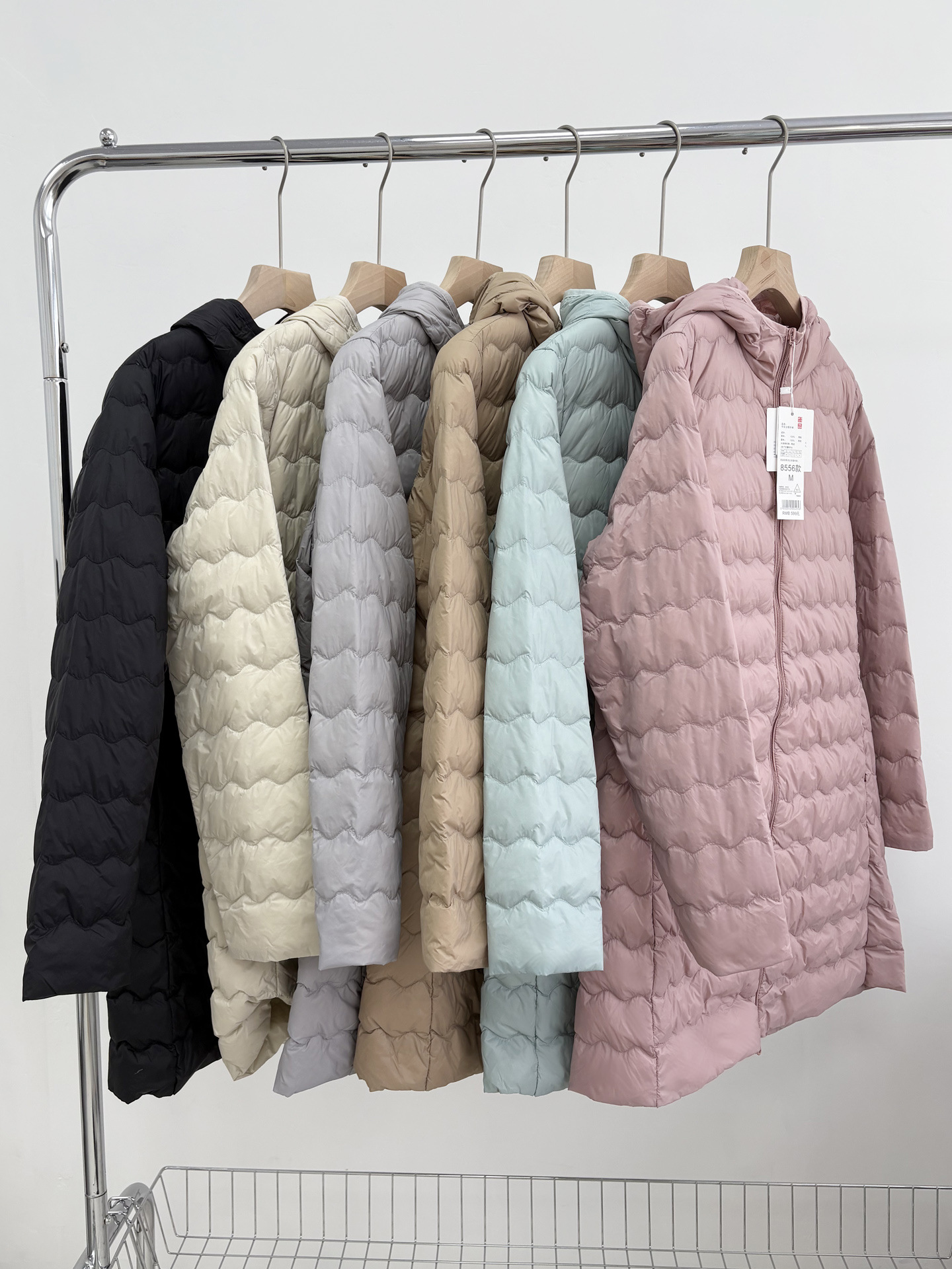 2025 otoño y invierno nueva chaqueta de pluma ligera y delgada mujer larga con capuzas de pluma cálida forro interior de pluma amplia chaqueta suelta