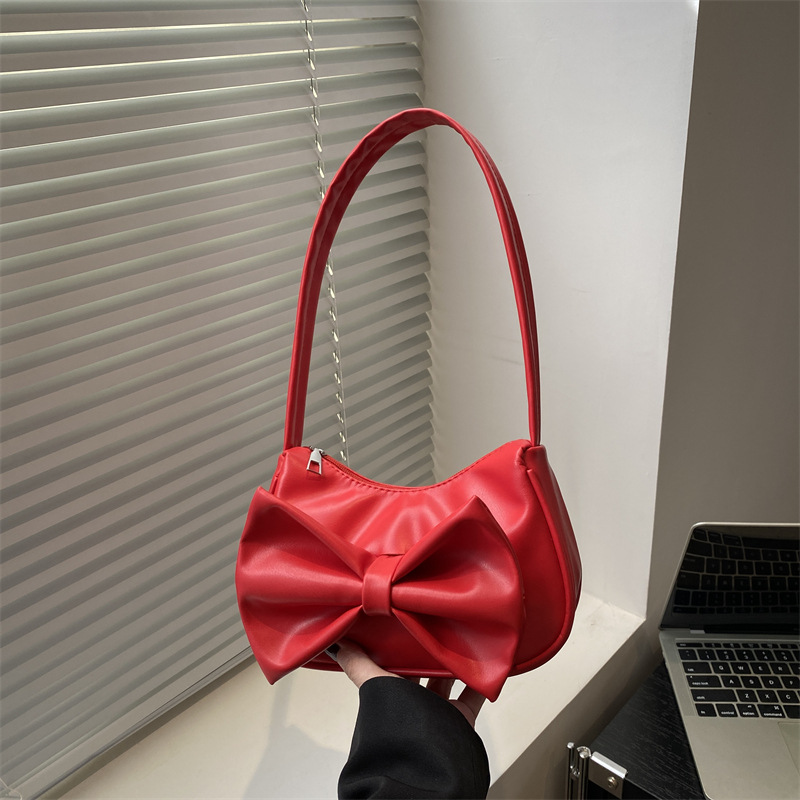 Bolso de axila con lazo de moda 2025 verano nuevo producto moda simple viajero estilo explosivo transfronterizo todo fósforo bolso femenino de un solo hombro