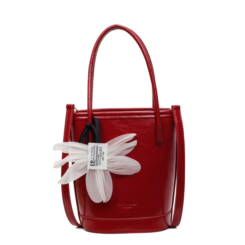 Bolso de moda personalizado bolso de cubo de textura de color sólido 2025 nuevo bolso de hombro de color sólido casual bolso de mensajero de cercanías