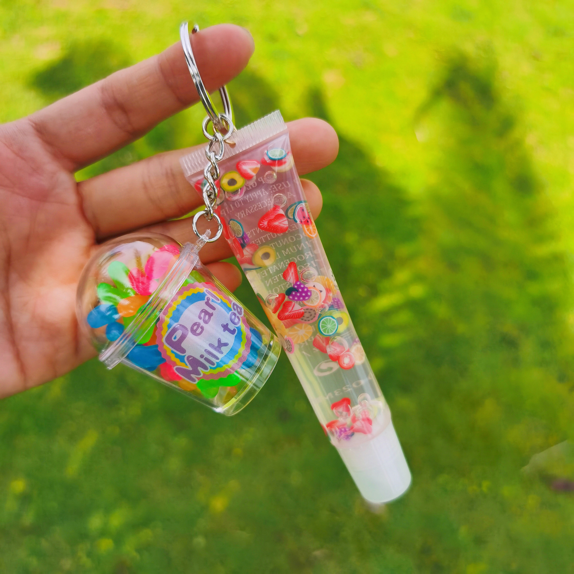 Shangxin niños cosméticos mecedora música llavero colgante tropical fruta niños piel bola colgante labio esmalte no lo