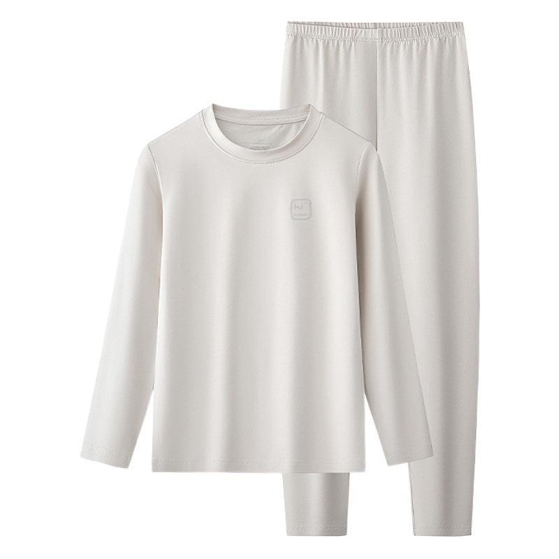 Conjunto de pantalones y tops térmicos finos de manga larga para niños y niñas de otoño e invierno de algodón modal, adecuado para salir o como pijama, color sólido, en stock.