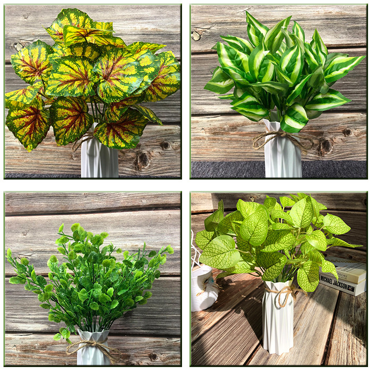 Accesorios de planta de simulación de fábrica falsa planta verde decoración de pared planta de plástico césped falso mango de flores manojo de hojas al por mayor