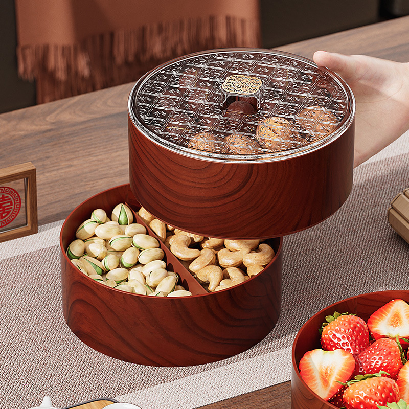 La Mesa de café de la Sala de estar de la nueva bandeja de frutos secos de madera China divide las cajas de caramelos y semillas de melón en varias capas y superpone las cajas de almacenamiento.