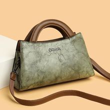 G5U真皮女包复古斜跨包2024新款牛皮高级感中年妈妈单肩包时尚旗