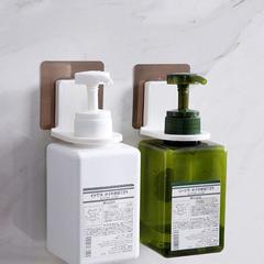 Press the hotel soap bottle onto the bathroom soap dispenser rack, bathroom pull-down wall-mounted shower gel holder