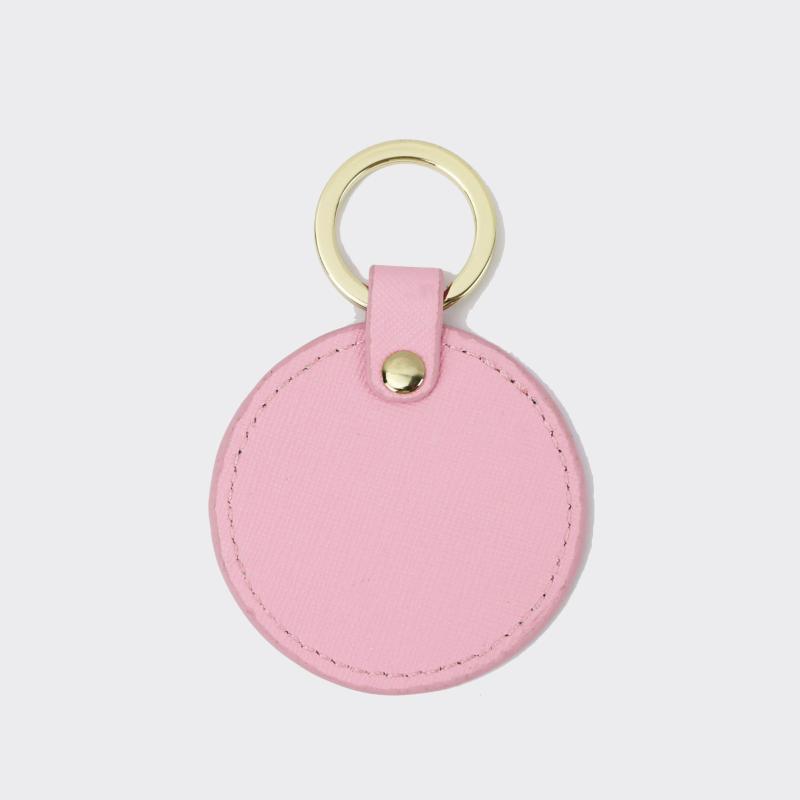 Llavero redondo de cuero genuino personalizado creativo simple colgante hombres y mujeres pequeño exquisito pequeño regalo al por mayor todo a juego